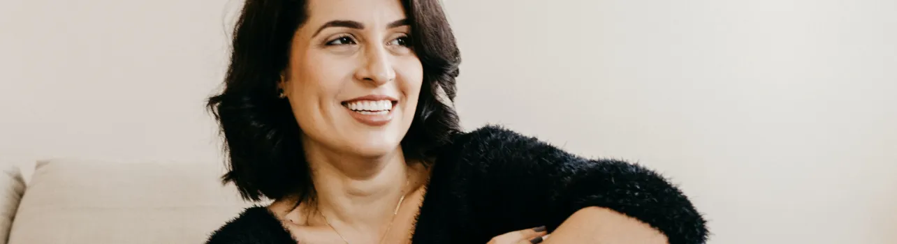 woman black sweater smiling