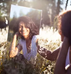 woman looking mirror